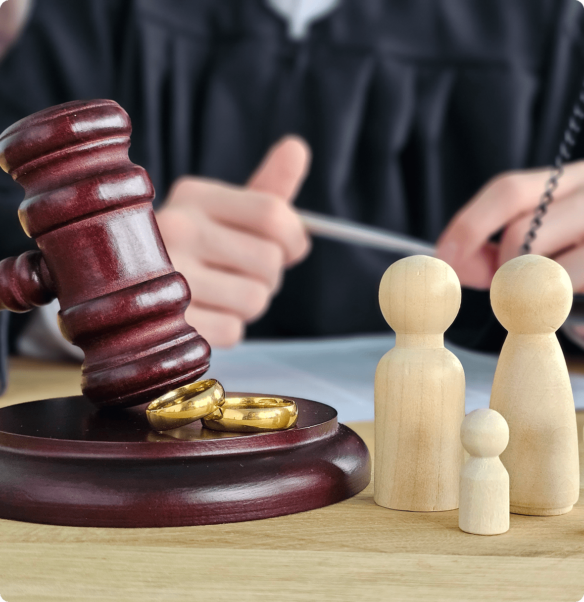 Gavel and rings symbolize divorce proceedings