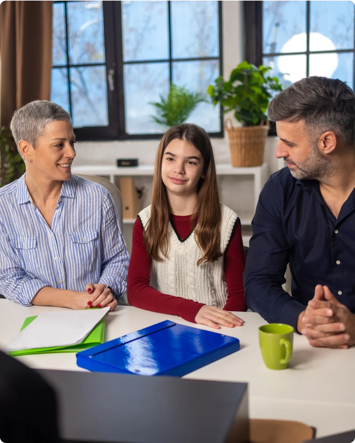 Family meeting at home around table