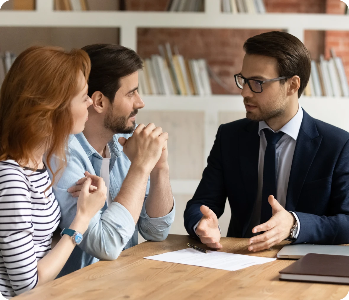 Couple consulting with financial advisor