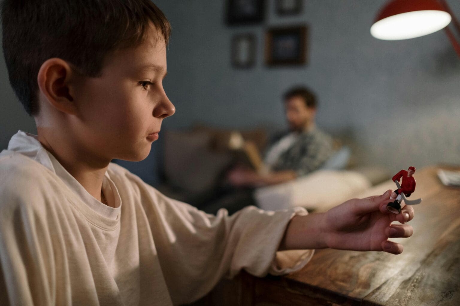 Kid focused on small toy